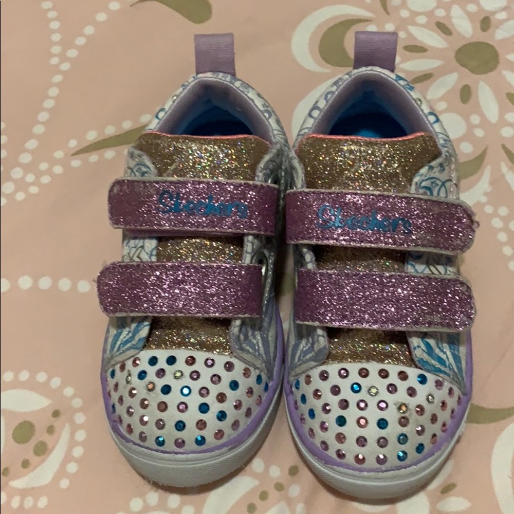 Toddler girl slightly used twinkle toes shoes.